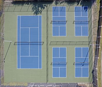 A tennis court with four tennis courts.